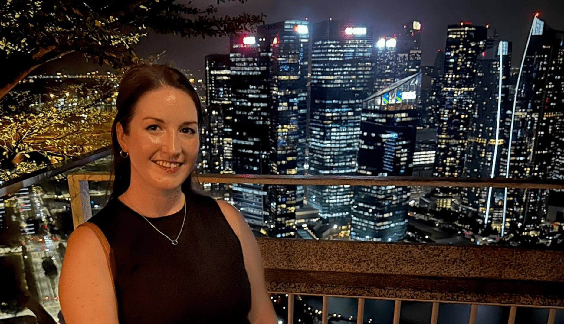 Jessica in front of Singapore at night