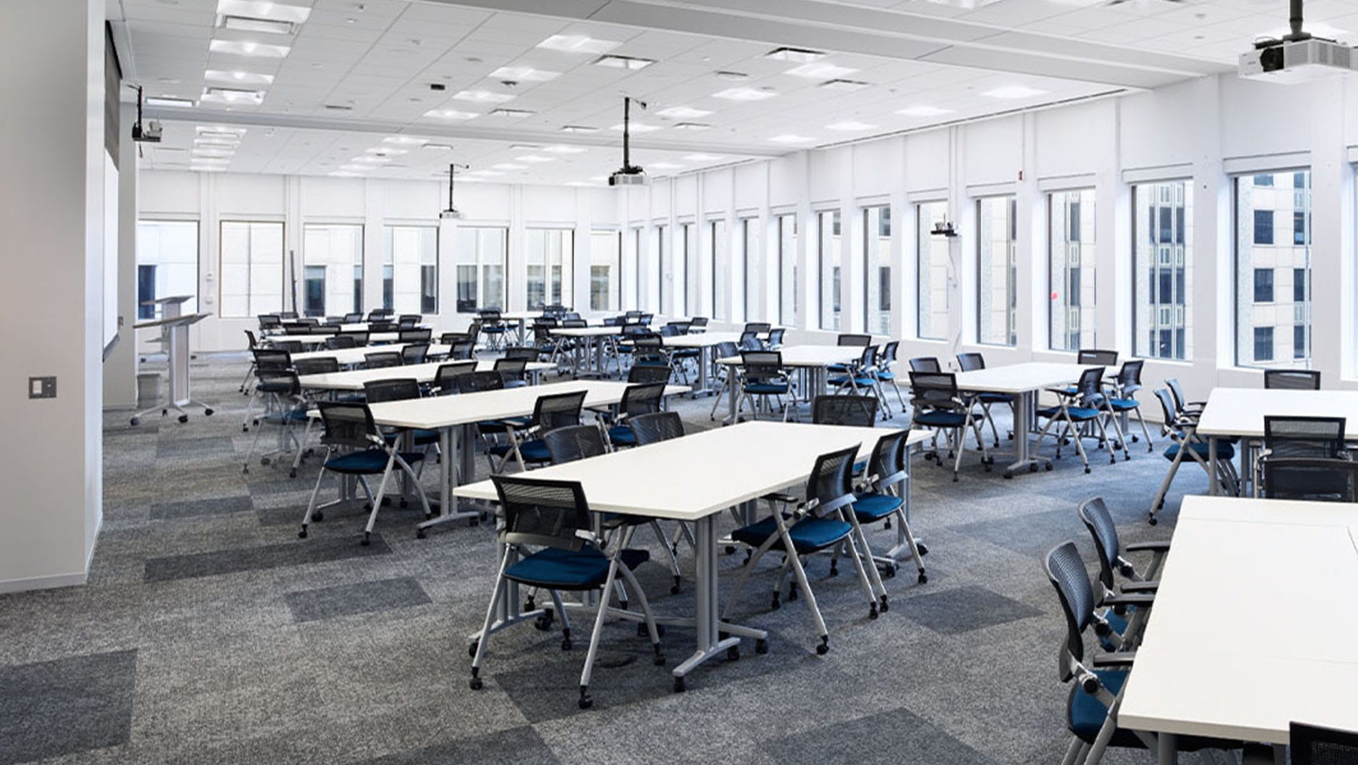 Training spaces with white boards, projectors, and optional room dividers