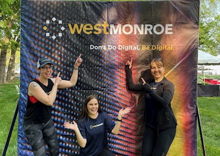 West Monroe employees at marathon booth