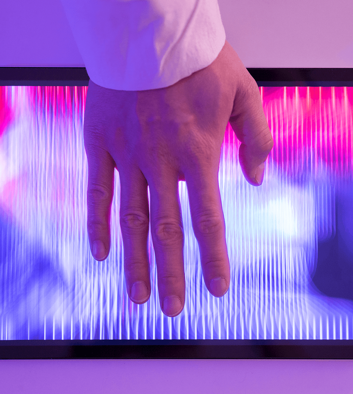 Hand touching tablet screen