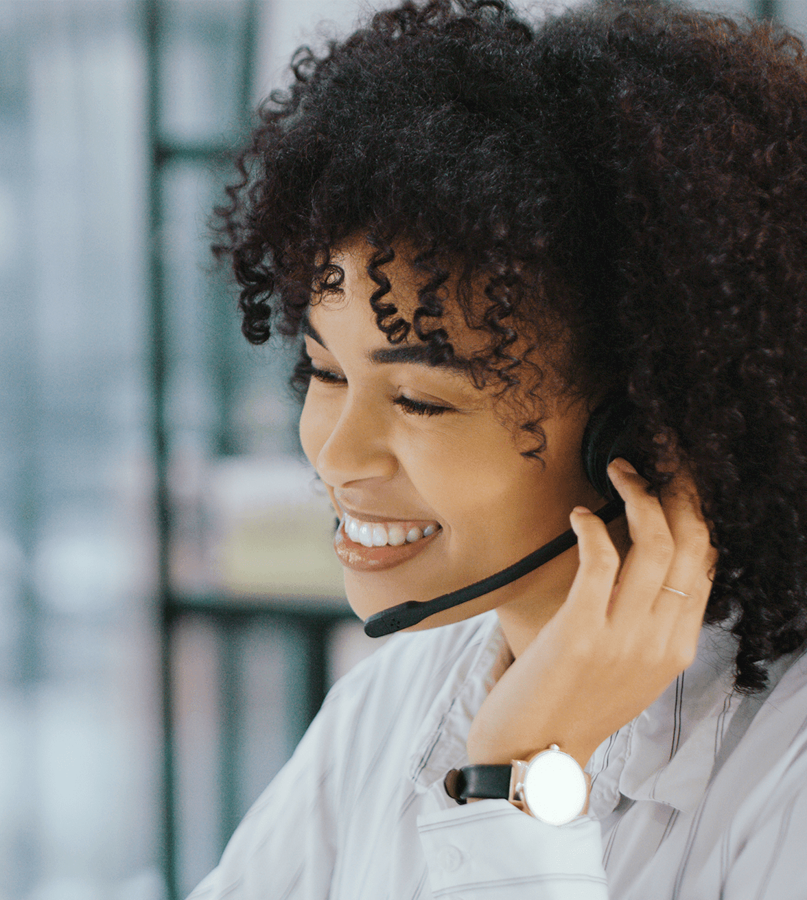 Woman smiling with call center headset