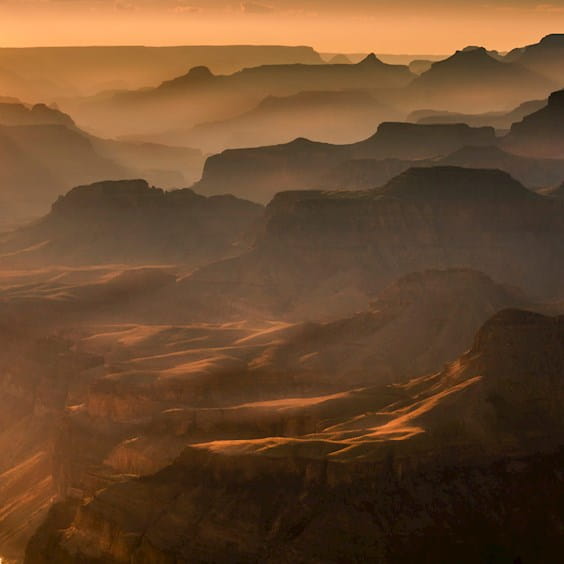foggy sunrise over canyons