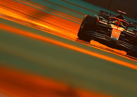 formula 1 car on the track during sunset