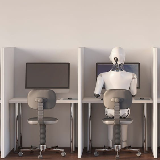 robot sitting at a computer station