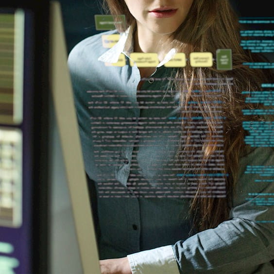 woman reviewing data on her computer